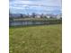 Serene backyard view with a pond and wooden fence, offering a peaceful outdoor retreat at 11985 Cat Tail Ct, Noblesville, IN 46060