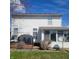 Back exterior featuring an enclosed sunroom and back deck with covered grill at 11985 Cat Tail Ct, Noblesville, IN 46060