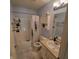 Bathroom includes a sink, vanity, mirror, bathtub, toilet, and shower with floral curtain at 11985 Cat Tail Ct, Noblesville, IN 46060