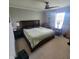 Cozy bedroom with a ceiling fan, large window, and soft carpet at 11985 Cat Tail Ct, Noblesville, IN 46060