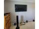 Bedroom featuring a TV, dresser, weights, and a fan at 11985 Cat Tail Ct, Noblesville, IN 46060