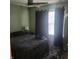 Bedroom showcases a cozy atmosphere with dark grey walls, carpet, and complementing black curtains at 11985 Cat Tail Ct, Noblesville, IN 46060