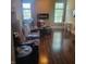 Spacious living room with hardwood floors, modern fireplace, and large windows at 11985 Cat Tail Ct, Noblesville, IN 46060