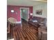 Comfortable living room with hardwood floors, stylish decor, and ample seating at 11985 Cat Tail Ct, Noblesville, IN 46060