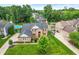 Aerial view of a brick home, with a pool and lush greenery adding to its curb appeal at 11995 Gray Eagle Dr, Fishers, IN 46037