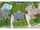 Aerial shot of backyard with pool, patio, and beautiful landscaping of property at 11995 Gray Eagle Dr, Fishers, IN 46037