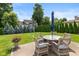 Charming backyard patio with wicker furniture and a lush lawn, perfect for outdoor entertaining at 11995 Gray Eagle Dr, Fishers, IN 46037