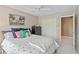 Bedroom features a closet, dresser, and cheerful decor at 11995 Gray Eagle Dr, Fishers, IN 46037