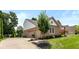 Attached three-car garage with an extra basketball hoop on the side of the property at 11995 Gray Eagle Dr, Fishers, IN 46037