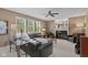 Cozy living room with a fireplace, large windows and comfortable seating at 11995 Gray Eagle Dr, Fishers, IN 46037
