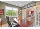 Cozy home office with built-in desk, overhead lighting, and a window at 11995 Gray Eagle Dr, Fishers, IN 46037