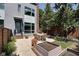 Charming backyard with concrete patio, raised garden beds, and lush greenery at 1311 Central Ave, Indianapolis, IN 46202