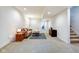 Finished basement with plush carpeting, neutral tones, and ample space for relaxation and recreation at 1311 Central Ave, Indianapolis, IN 46202