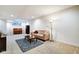 Spacious finished basement offers a cozy seating area and vintage piano at 1311 Central Ave, Indianapolis, IN 46202