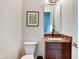 This bathroom features a vanity with granite countertops and framed art at 1311 Central Ave, Indianapolis, IN 46202