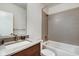 Bathroom with a modern vanity, bathtub, and tiled shower for a clean, updated look at 1311 Central Ave, Indianapolis, IN 46202