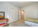 Bedroom with carpet, a small bed, and closet space at 1311 Central Ave, Indianapolis, IN 46202