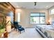 This bedroom features carpeted floors, accent wall and large windows with natural light at 1311 Central Ave, Indianapolis, IN 46202