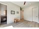 Bright bedroom with wood flooring and an ensuite bathroom, offering privacy and convenience at 1311 Central Ave, Indianapolis, IN 46202