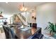 Open-concept dining area with modern lighting and view to a staircase provides an excellent entertainment space at 1311 Central Ave, Indianapolis, IN 46202