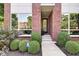 Front entrance showcases neat landscaping and glass-paneled front door, creating inviting curb appeal at 1311 Central Ave, Indianapolis, IN 46202