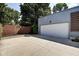 Spacious detached garage with large driveway providing ample parking space at 1311 Central Ave, Indianapolis, IN 46202