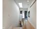 Bright hallway with natural light and hardwood floors leads to living space at 1311 Central Ave, Indianapolis, IN 46202