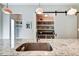 Beautiful kitchen with stainless sink and faucet in granite island, sliding barn door pantry in background at 1311 Central Ave, Indianapolis, IN 46202