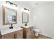 Modern bathroom showcasing double vanity with beautiful countertops and contemporary fixtures at 13264 Penneagle Dr, Carmel, IN 46033