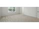 Bedroom features neutral carpet, a window, and easy access to hallway at 13264 Penneagle Dr, Carmel, IN 46033