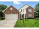 Charming two-story home features a brick facade, attached garage, and well-maintained lawn at 13264 Penneagle Dr, Carmel, IN 46033