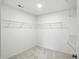 A walk-in closet with white walls, carpet, and metal shelves for storage at 13264 Penneagle Dr, Carmel, IN 46033