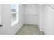 Walk-in closet features neutral carpet, a window, and shelving at 13264 Penneagle Dr, Carmel, IN 46033