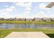 Backyard view overlooking a scenic pond in a quiet residential neighborhood at 1418 Blackthorne S Trl, Plainfield, IN 46168