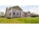 Green backyard featuring a large grassy lawn, an expansive patio, and view of back of home at 1418 Blackthorne S Trl, Plainfield, IN 46168