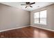 Bedroom offers hardwood floors, neutral paint, and natural light from the window at 1418 Blackthorne S Trl, Plainfield, IN 46168