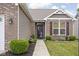 Inviting front entrance with brick accents and manicured landscaping at 1418 Blackthorne S Trl, Plainfield, IN 46168