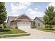 Well-kept lawn and landscaping add to this home's inviting exterior at 1418 Blackthorne S Trl, Plainfield, IN 46168