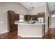 Modern kitchen features stainless steel appliances and a breakfast bar at 1418 Blackthorne S Trl, Plainfield, IN 46168