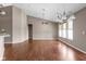 Bright living room with hardwood floors, neutral paint, vaulted ceiling, and plenty of natural light at 1418 Blackthorne S Trl, Plainfield, IN 46168