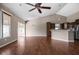 Open living area connects to the kitchen, offering hardwood floors and high ceilings at 1418 Blackthorne S Trl, Plainfield, IN 46168