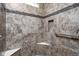A meticulously tiled shower with a corner shelf, mosaic accent tiles, and a sturdy grab bar for support at 1418 Blackthorne S Trl, Plainfield, IN 46168