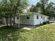 Backyard featuring a covered patio and a well-maintained lawn at 1605 S Leland Ave, Indianapolis, IN 46203