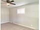 Bedroom with neutral paint and carpet features a window at 1605 S Leland Ave, Indianapolis, IN 46203