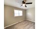 Carpeted bedroom features a ceiling fan and a window at 1605 S Leland Ave, Indianapolis, IN 46203