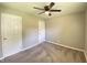 Comfortable bedroom with a ceiling fan and neutral tones, offering a relaxing and serene atmosphere at 1605 S Leland Ave, Indianapolis, IN 46203
