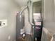 Furnace room with water heater and Goodman furnace at 1605 S Leland Ave, Indianapolis, IN 46203