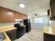 Cozy kitchen with butcher block countertops, black appliances, and white brick walls for a modern farmhouse feel at 1605 S Leland Ave, Indianapolis, IN 46203