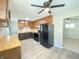 Functional kitchen featuring butcher block countertops, black appliances, and a bright, airy atmosphere at 1605 S Leland Ave, Indianapolis, IN 46203