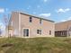 Expansive backyard featuring a well-kept lawn and views of the home's back exterior at 164 Luna Pl, Shelbyville, IN 46176